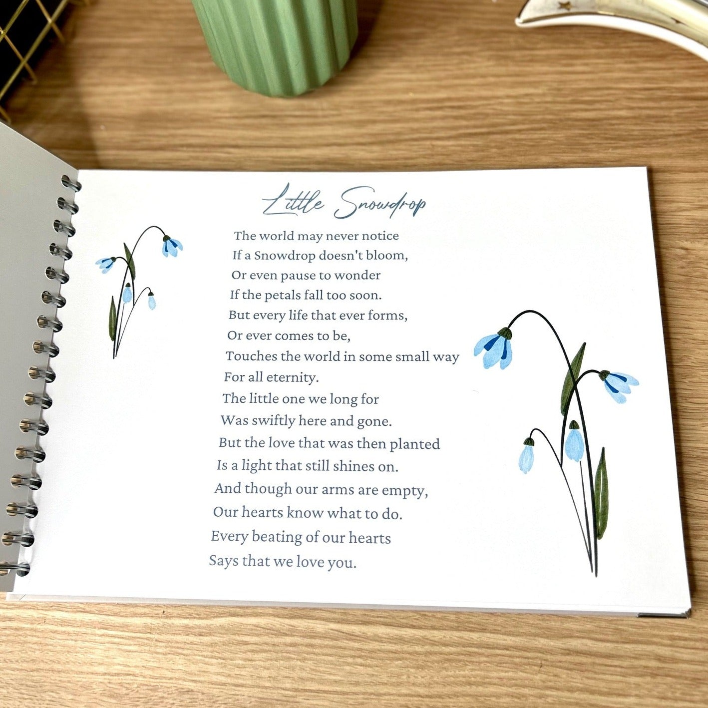 A poem called 'Little Snowdrop is printed on the first oage of an A4 memory book with two images of Snowdrop flowers next to it