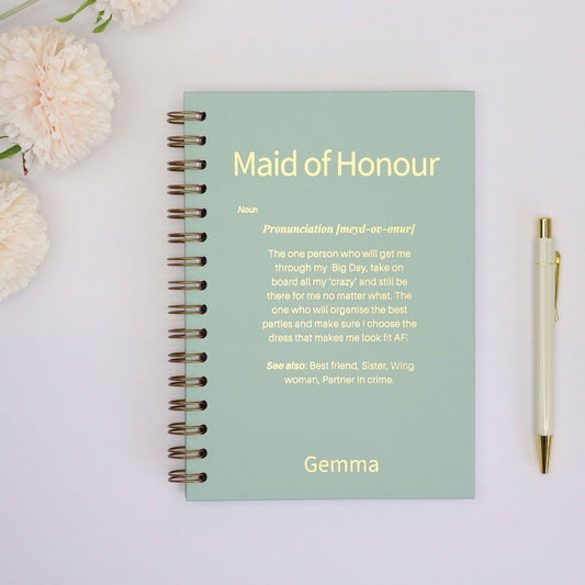 An A5 notebook in Sage with the words 'Maid of Honour' at the top then a discription underneath laid out and worded like a dictionary meaning. The name 'Gemma' is bottom central.