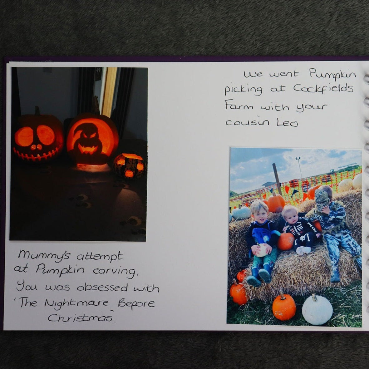 The inside pages of the halloween memory book, with pictures of carved pumpkins and small boys dressed n halloween costumes. There are captions with each picture explaining what was happening there. 