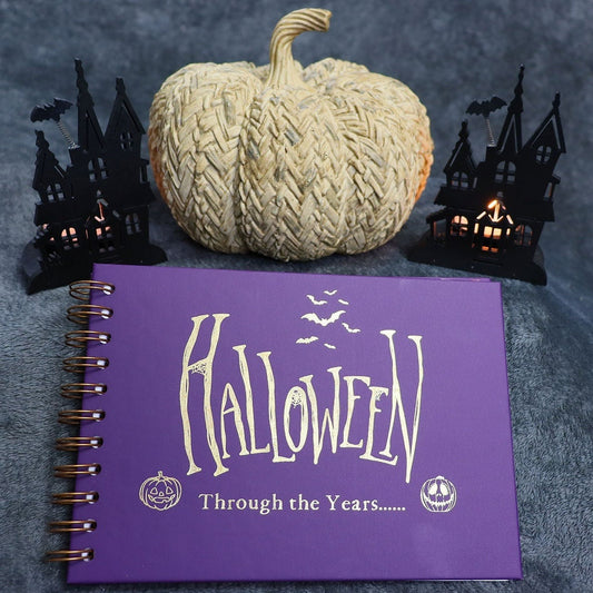 A5 purple memory book with the words 'Halloween through the years...'with two images of pumpkins all in gold foil