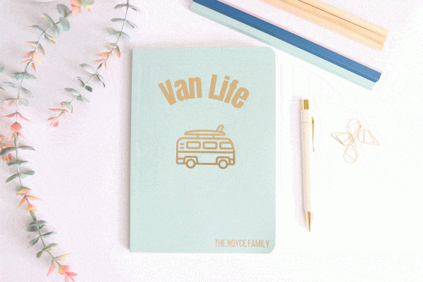 sage green soft back notebook with 'van life' in gold foil with a picture of a camper van and personalised at the bottom.